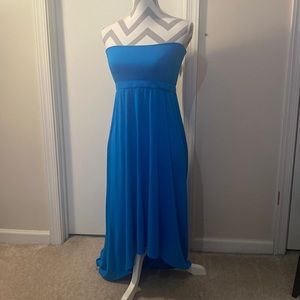 A beautiful blue dress. Short in the front, long in the back. A fun summer fit!